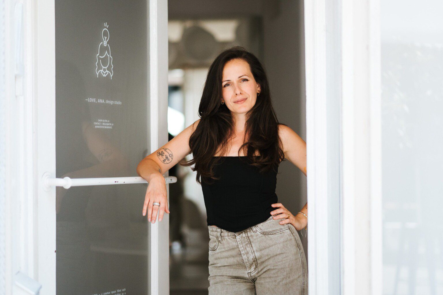 Ana Tevšić Nauković at the door of the –Love, Ana. studio in Dežmanov prolaz