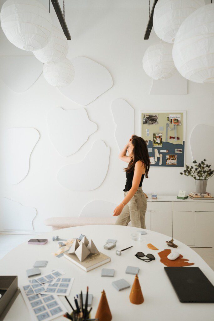 Ana Tevšić Nauković in the studio, paper lanterns and the white relief wall